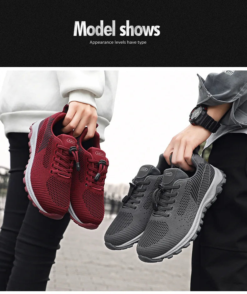 People display red and gray athletic walking shoes, showcasing the footwear's design.
